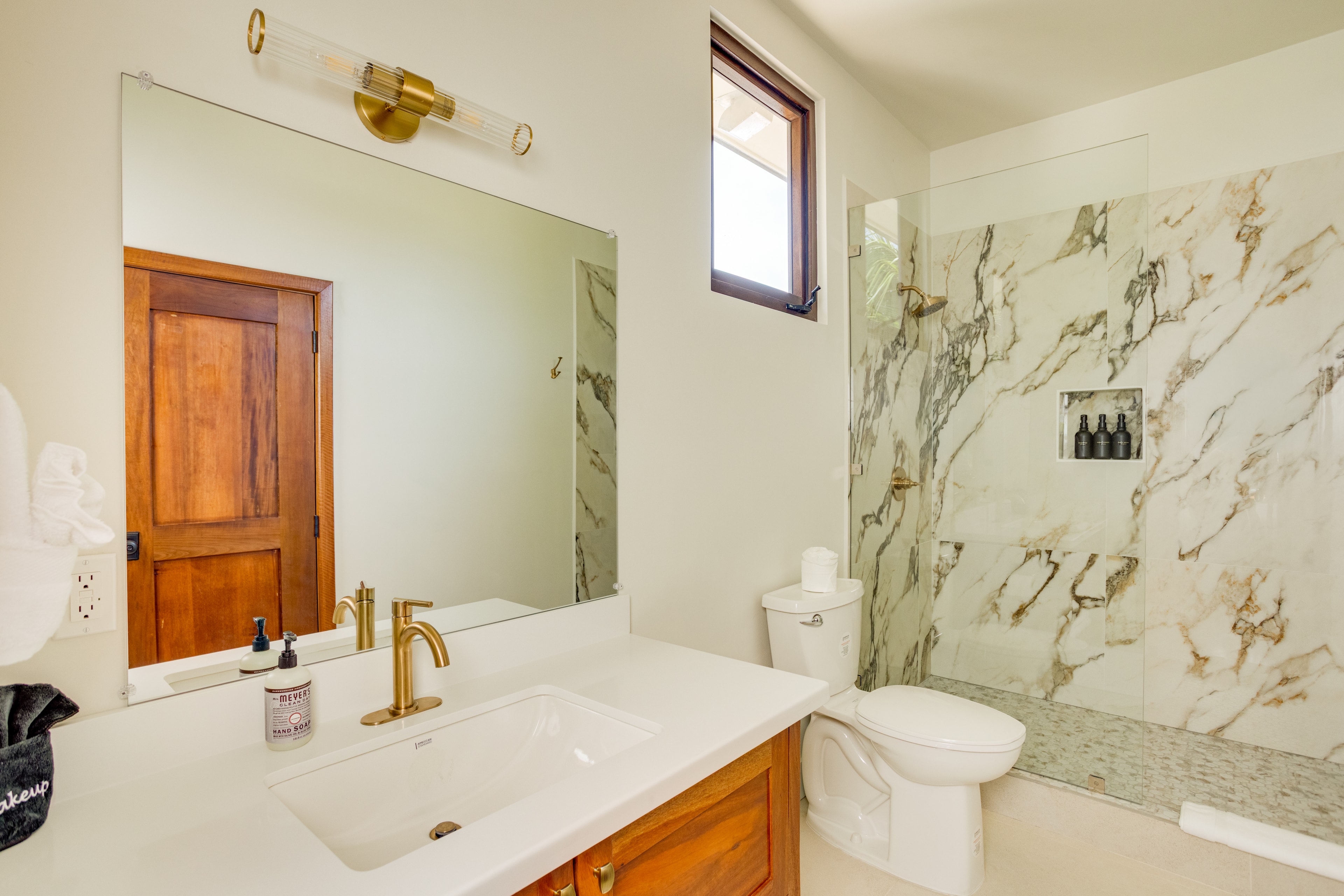 Upstairs Guest Suite bathroom with gold fixtures