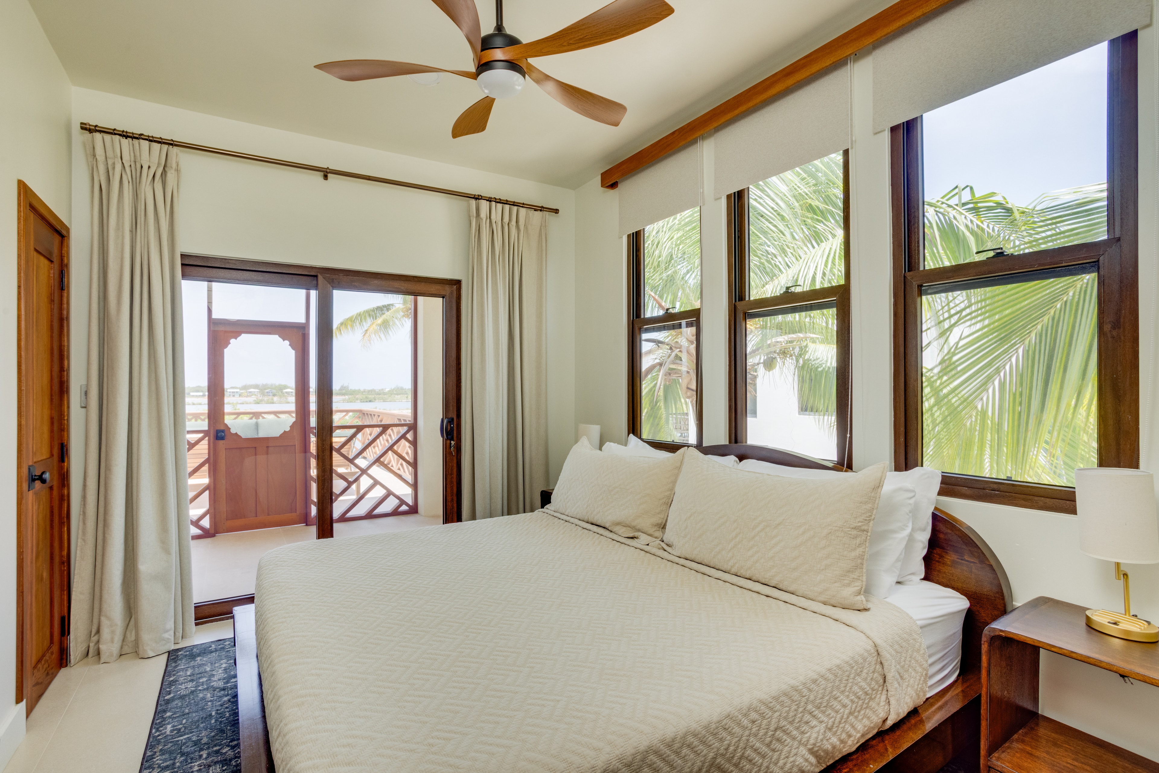 Upstairs Guest Suite king bed with lagoon views