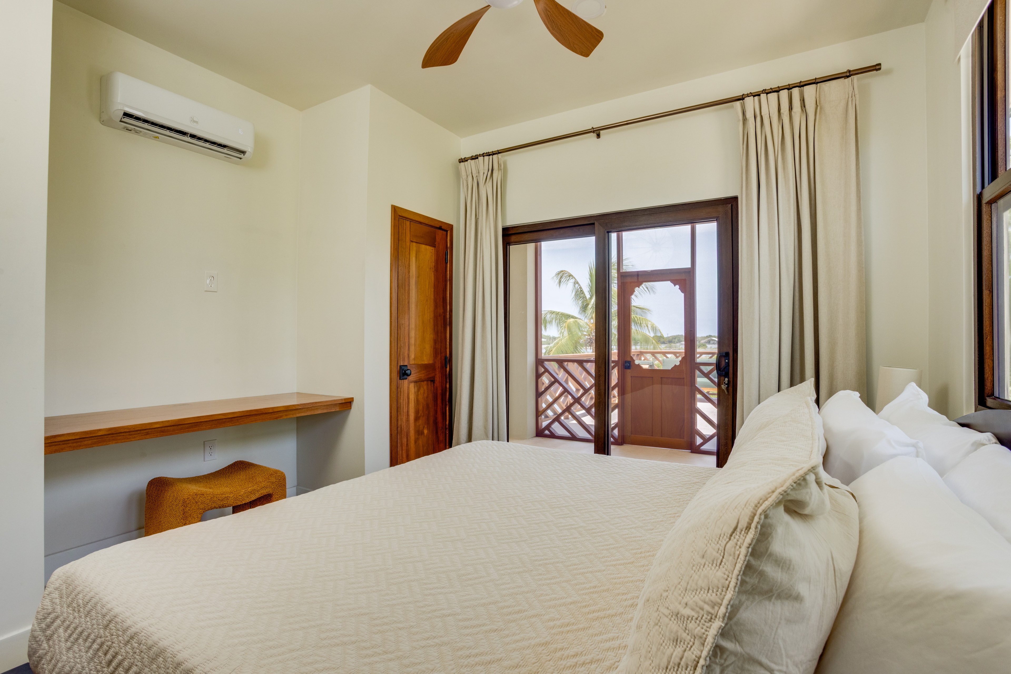 Upstairs Guest Suite bedroom with private deck access