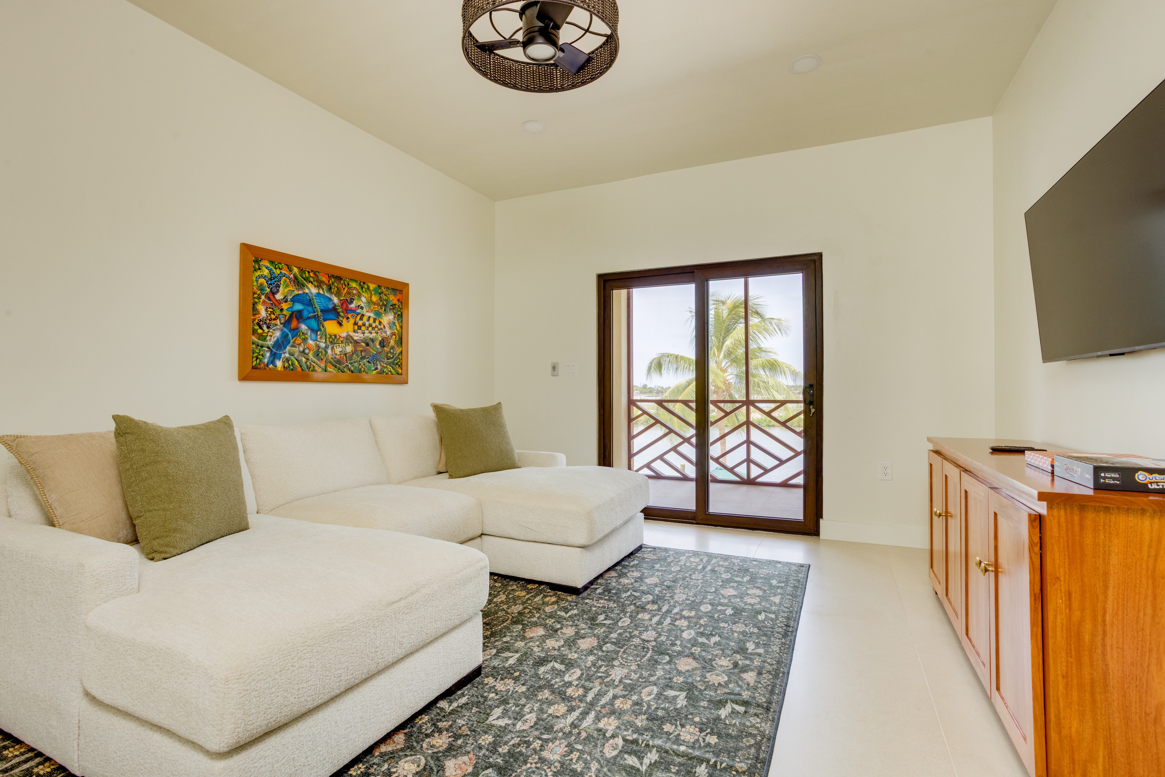 Living room with Belizean art and balcony