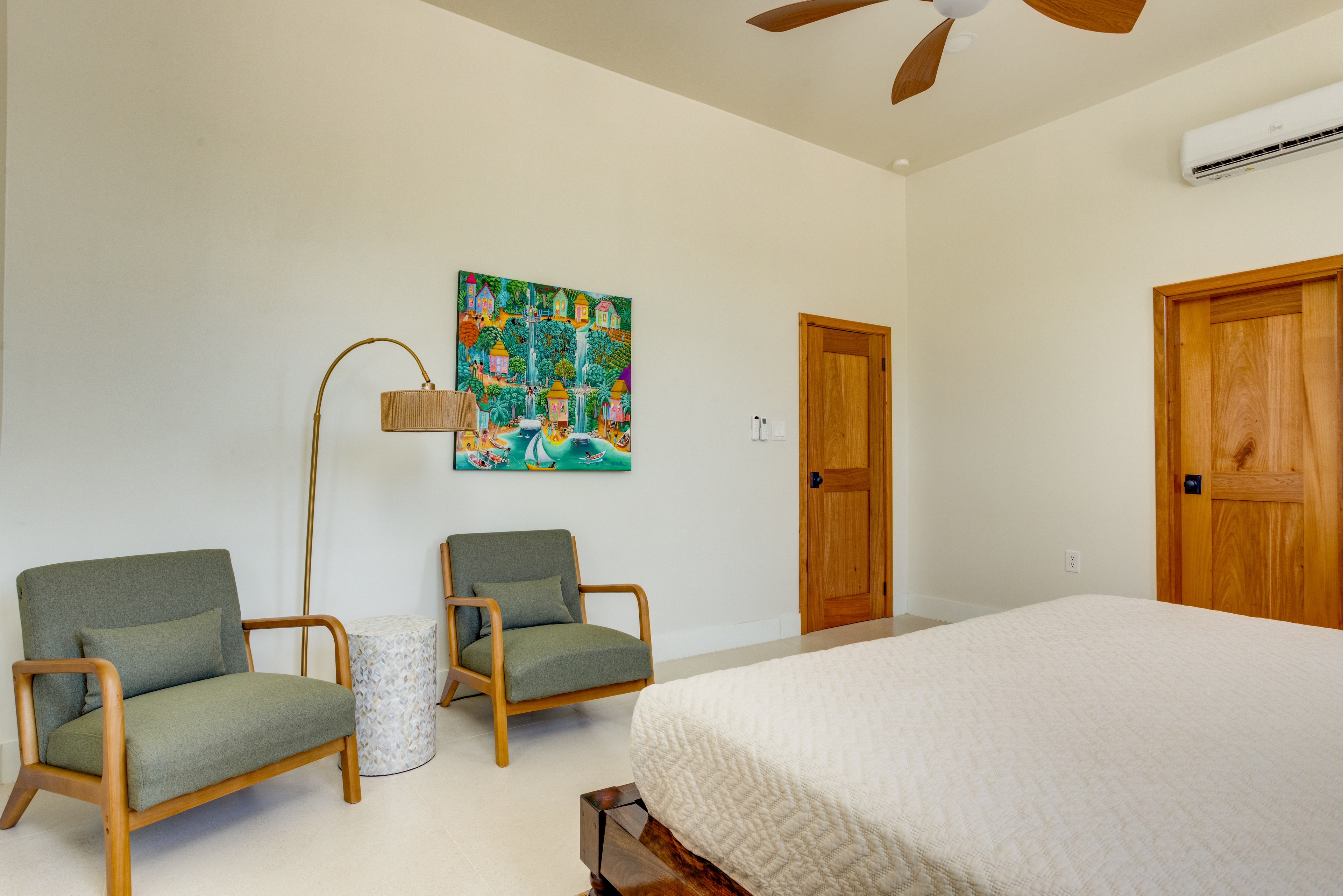 Master suite seating area with Belizean art